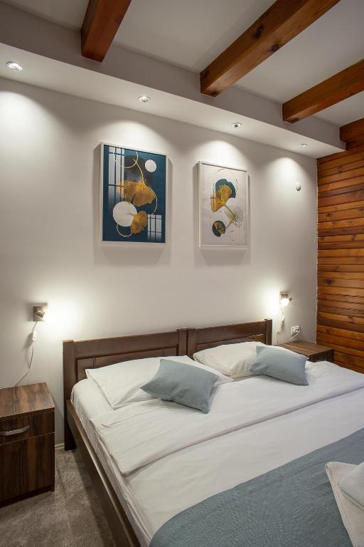 Postel nebo postele na pokoji v ubytování MB Hotel