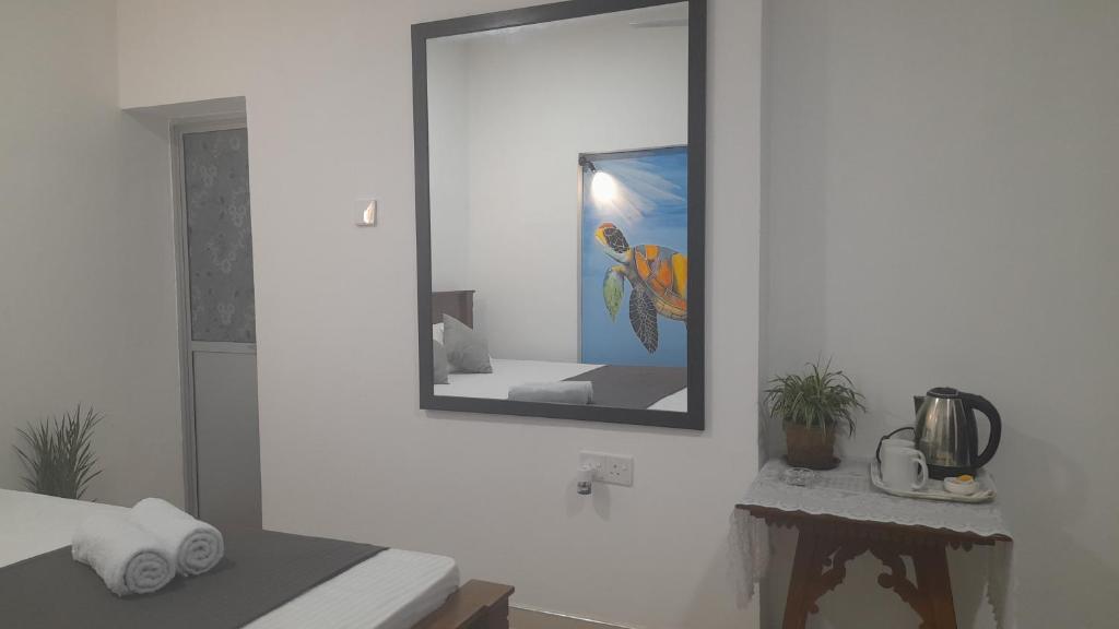 A bed or beds in a room at TaMaRiNd house
