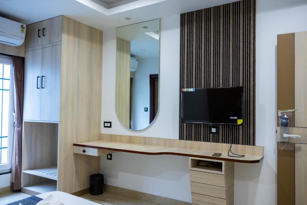 TV a/nebo společenská místnost v ubytování The Executive Inn