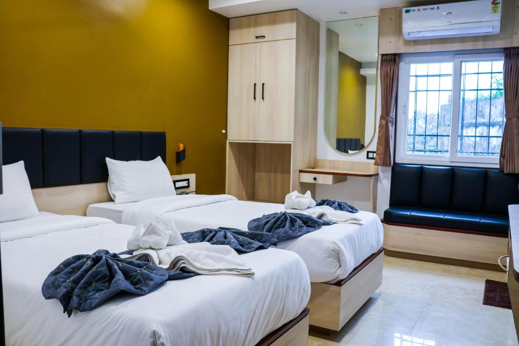 Postel nebo postele na pokoji v ubytování The Executive Inn