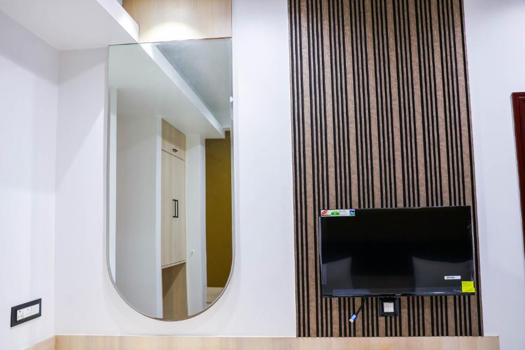 TV a/nebo společenská místnost v ubytování The Executive Inn