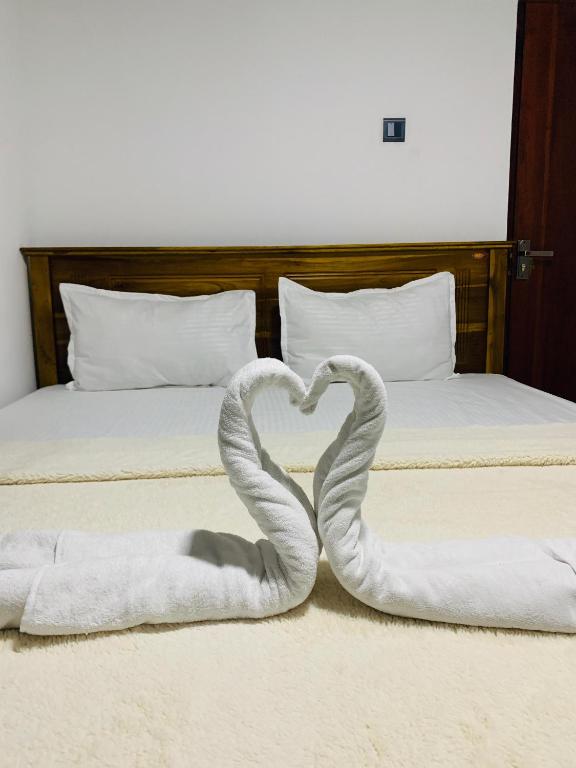 Postel nebo postele na pokoji v ubytování Nethuli Inn Ella