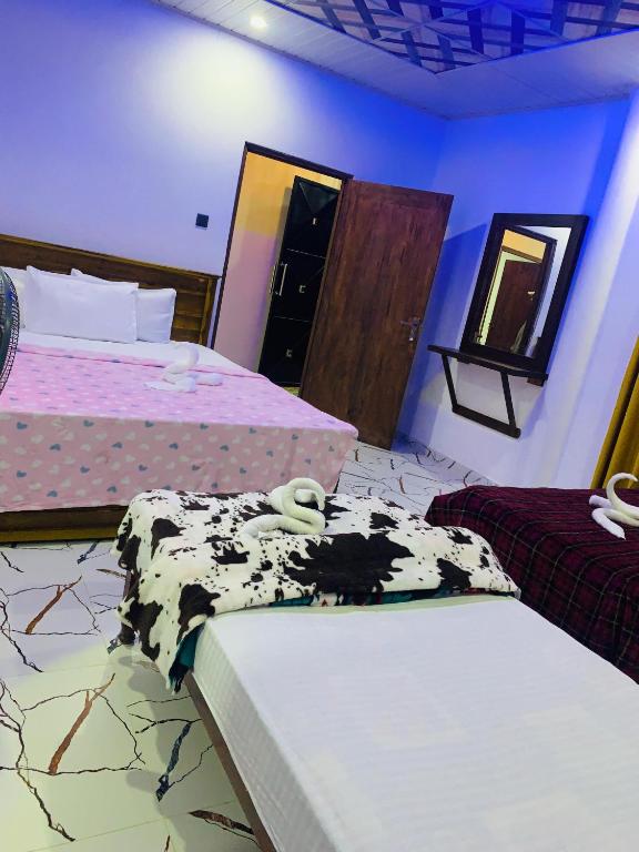 Postel nebo postele na pokoji v ubytování Nethuli Inn Ella