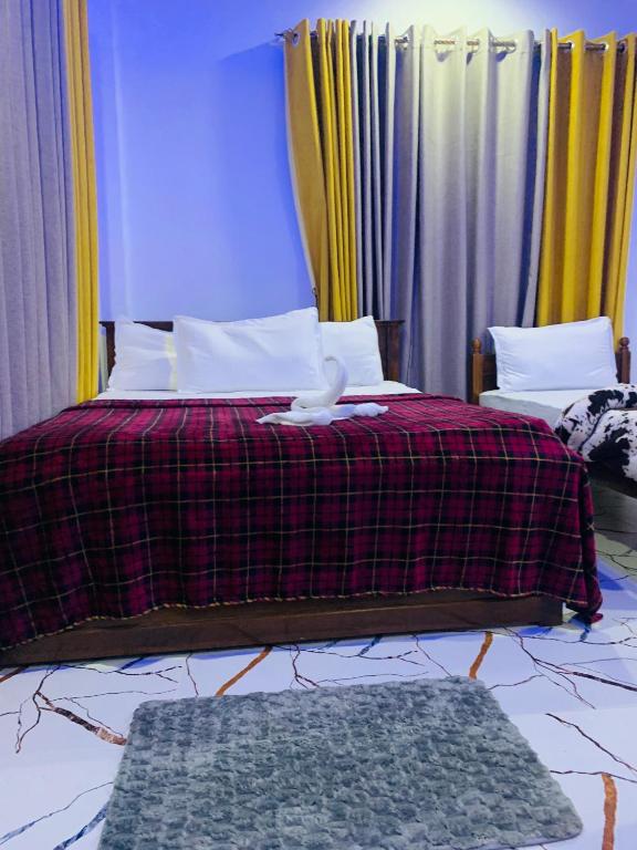 Postel nebo postele na pokoji v ubytování Nethuli Inn Ella
