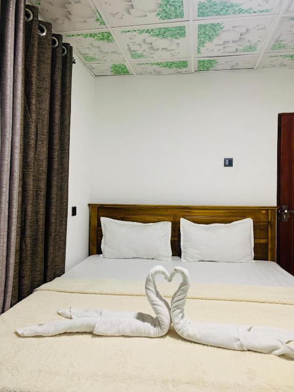 Postel nebo postele na pokoji v ubytování Nethuli Inn Ella