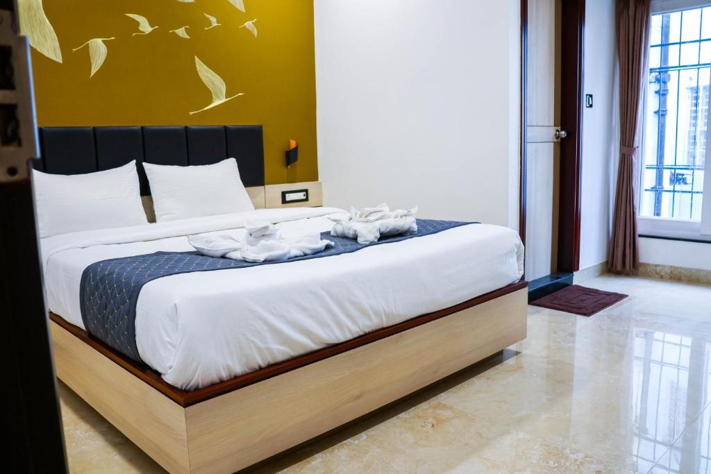 Postel nebo postele na pokoji v ubytování The Executive Inn