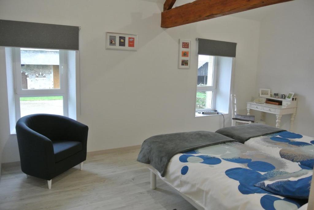 Postel nebo postele na pokoji v ubytování La Fresnée chambres d'hôtes