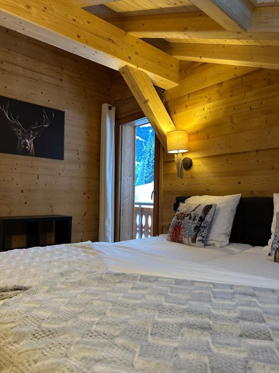 Postel nebo postele na pokoji v ubytování La Rose des neiges à Châtel