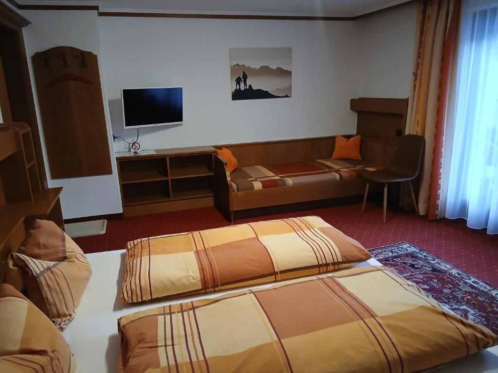 Postel nebo postele na pokoji v ubytování Gästehaus Tramnitz