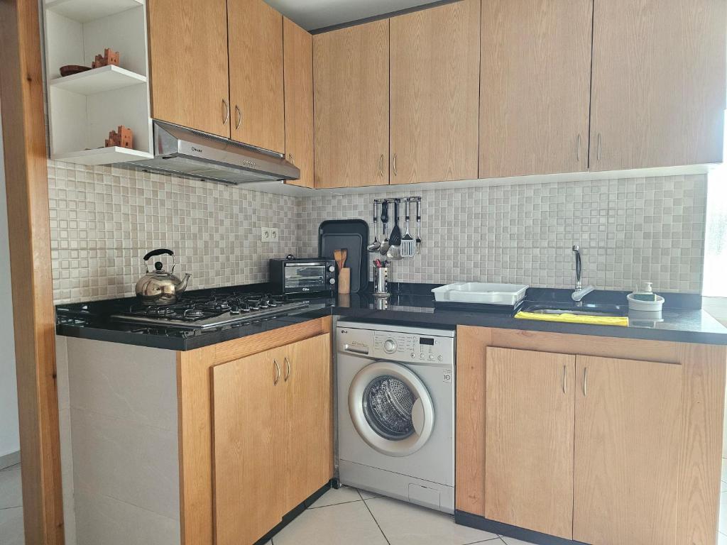 Kuchyň nebo kuchyňský kout v ubytování Appartement Al Amal