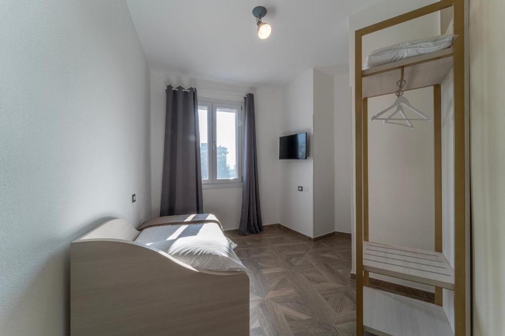 Postel nebo postele na pokoji v ubytování Hotel Donatello