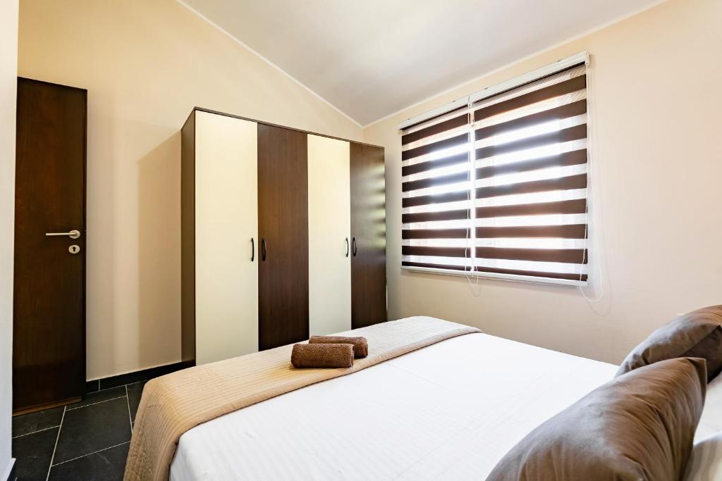 Posteľ alebo postele v izbe v ubytovaní D&A Apartments