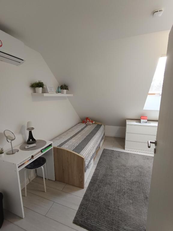 Postel nebo postele na pokoji v ubytování Apartman Nábrežná