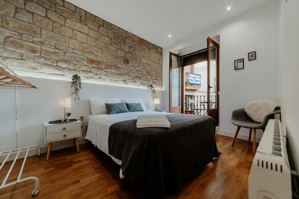 Giường trong phòng chung tại Apartamento Esencia San Vicente de la Sonsierra