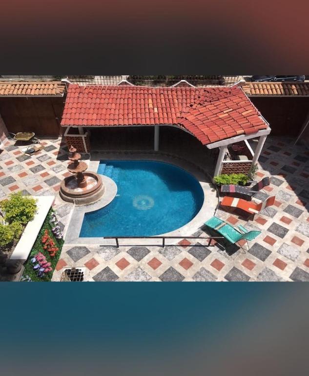 a model of a swimming pool with a roof at hotel brisas del pacifico in Puerto Vallarta