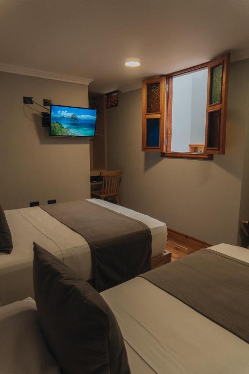 Hotel Entre Brumas房間的床