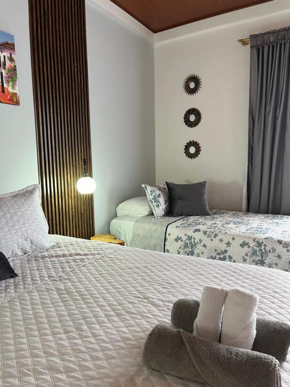 Postel nebo postele na pokoji v ubytování Hotel la casona de Wiky
