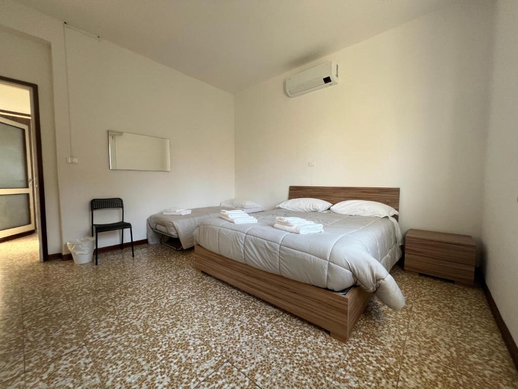 Postel nebo postele na pokoji v ubytování O&R Home Crema