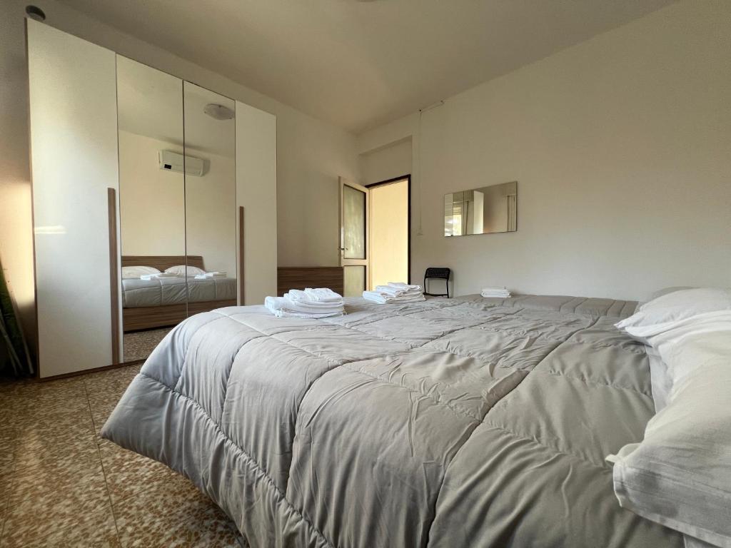 Postel nebo postele na pokoji v ubytování O&R Home Crema