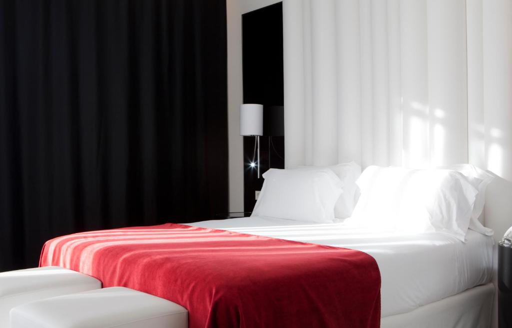 מיטה או מיטות בחדר ב-Hotel Porta Fira 4* Sup