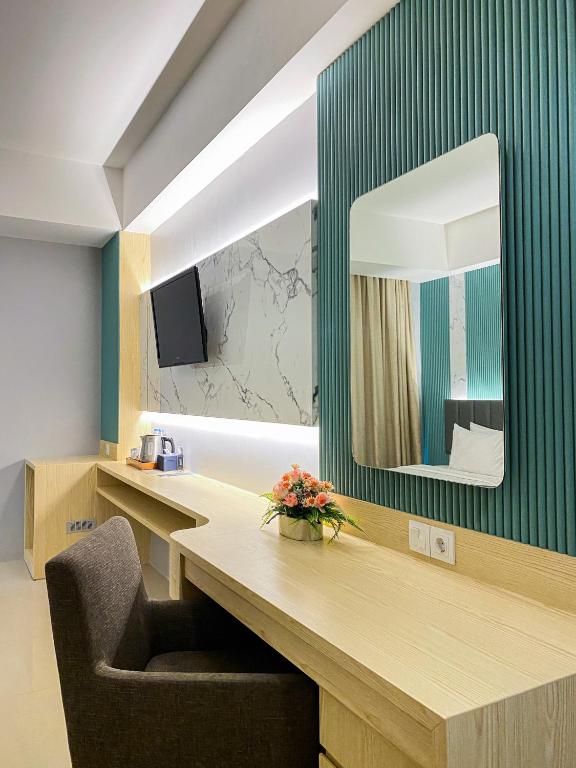 TV a/nebo společenská místnost v ubytování Luxury Malioboro Hotel