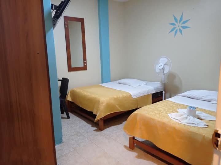 Postel nebo postele na pokoji v ubytování Hostal Real Piura - Oficial