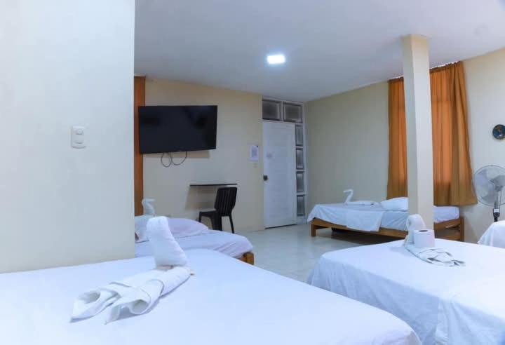 Postel nebo postele na pokoji v ubytování Hostal Real Piura - Oficial