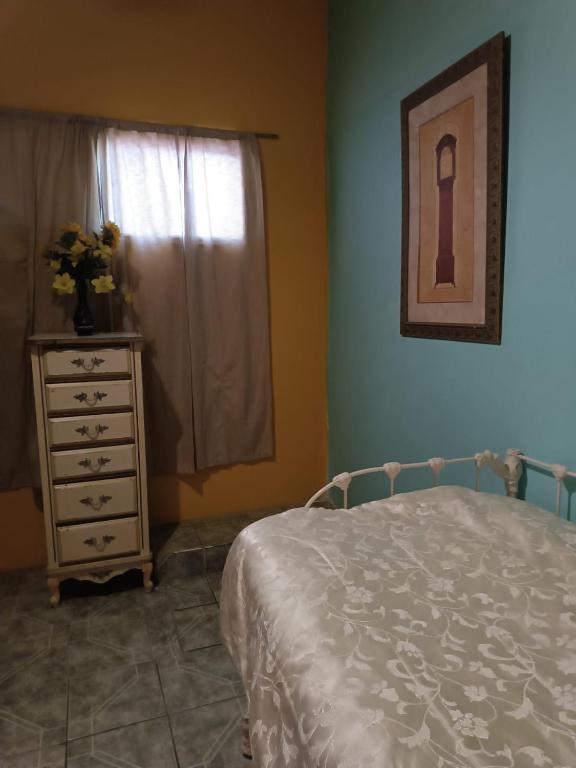 Postel nebo postele na pokoji v ubytování Hospedaje Barato Mi Casita de Colores