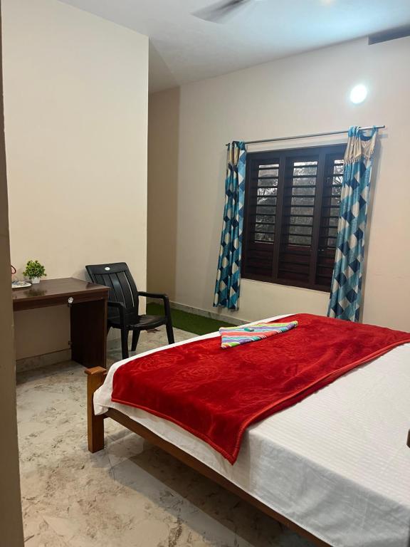 Postel nebo postele na pokoji v ubytování VARIYATH HOMESTAY THIRUNELLi