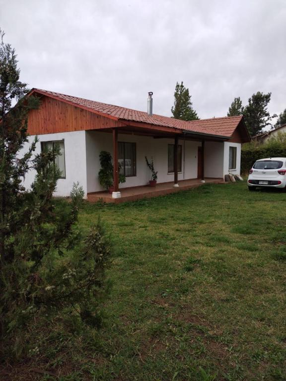 a house with a car parked in front of it at Casa Haciendado de Lolol in Alto de Nerquihue