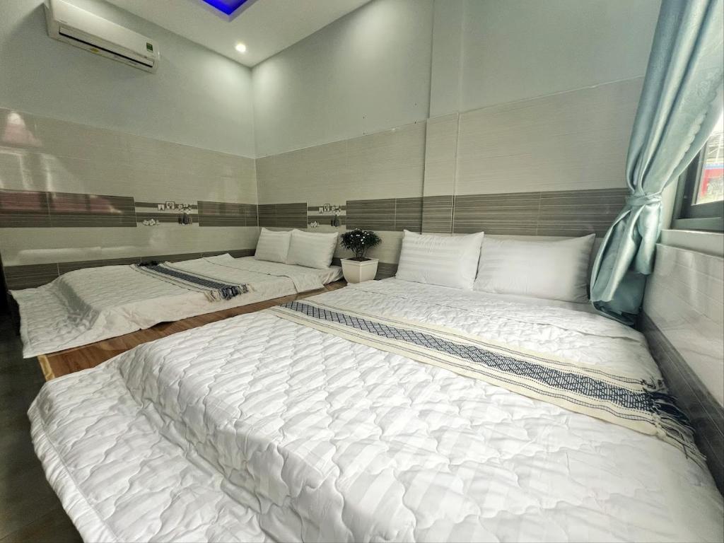 Postel nebo postele na pokoji v ubytování Ông 5 House