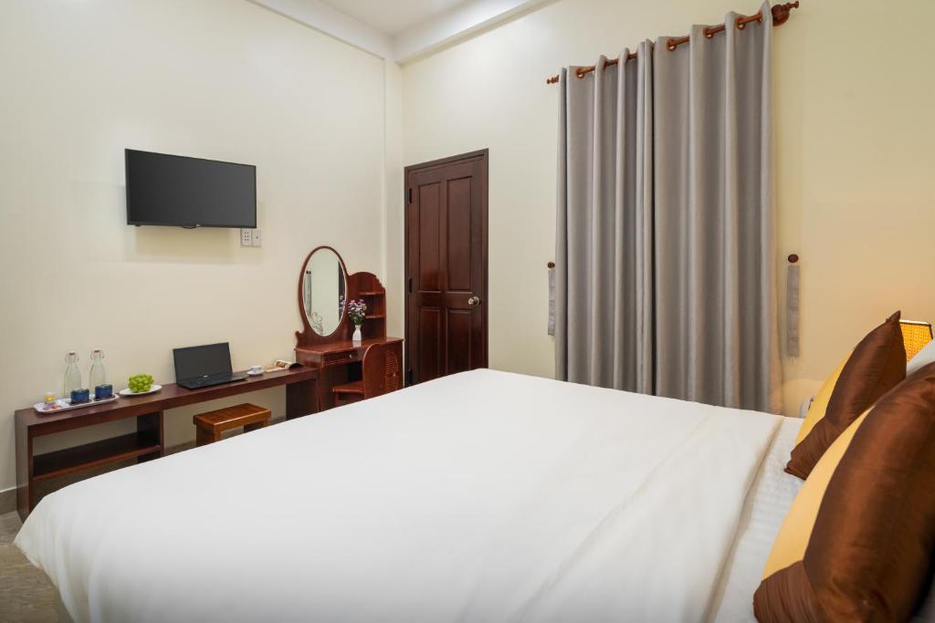 TV a/nebo společenská místnost v ubytování Sun Moon Riverside Hoi An