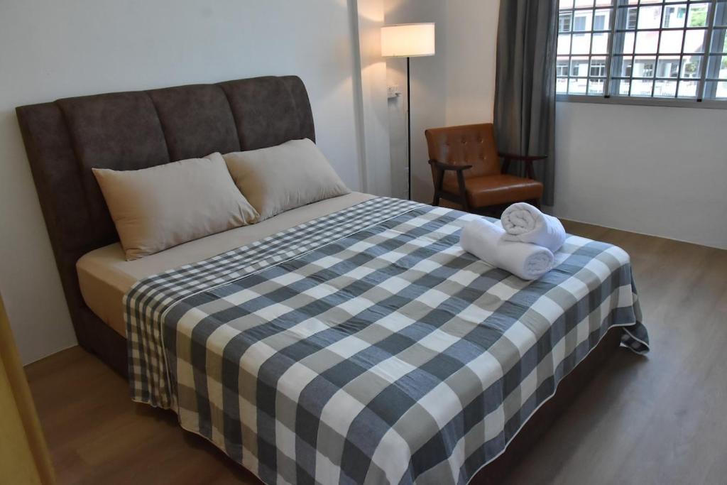 Postel nebo postele na pokoji v ubytování Rain Tree Homestay