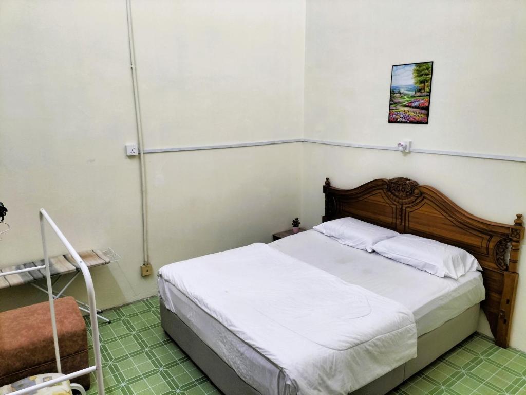 Postel nebo postele na pokoji v ubytování Homestay Pertama