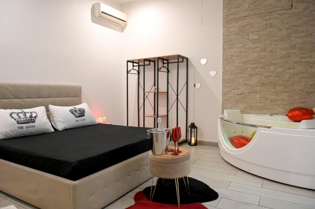 A bed or beds in a room at Momenti e wellness
