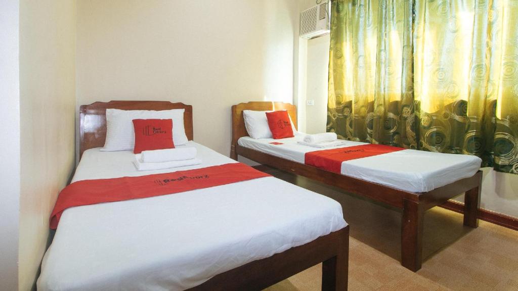 Postel nebo postele na pokoji v ubytování E. Moreno Recreation Beach Resort Ilocos Sur