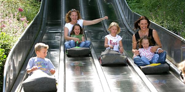 a group of children sitting on a roller coaster at Gasthof Holländer Eck in Lennestadt