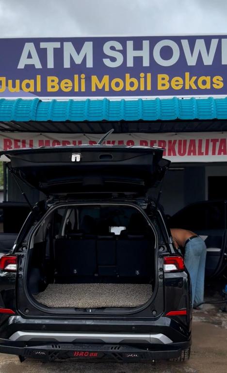 a car with its trunk open sitting in a garage at Car Rental Sewa Mobil Batam in Pulau Sembakau Kecil