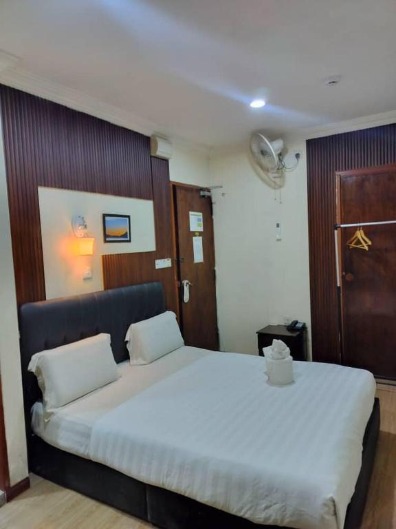 Postel nebo postele na pokoji v ubytování Alonto Hotel