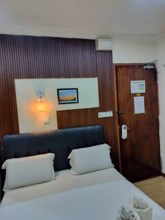 Postel nebo postele na pokoji v ubytování Alonto Hotel
