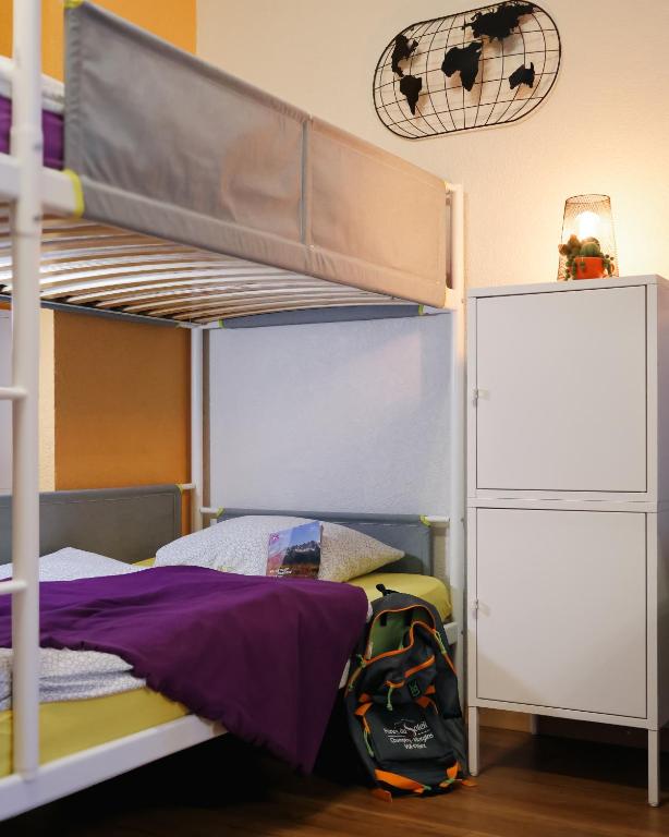 Postel nebo postele na pokoji v ubytování Backpacker Le Petit Baroudeur