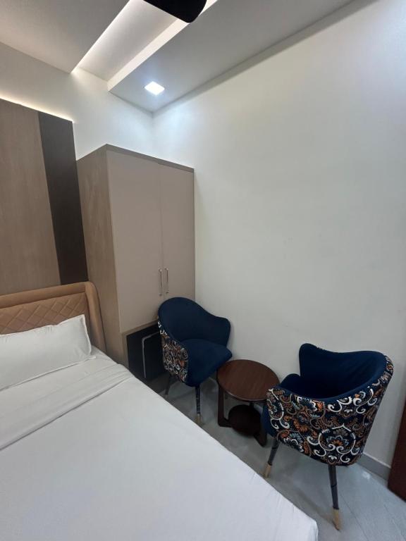 Postel nebo postele na pokoji v ubytování Kaspar Suites