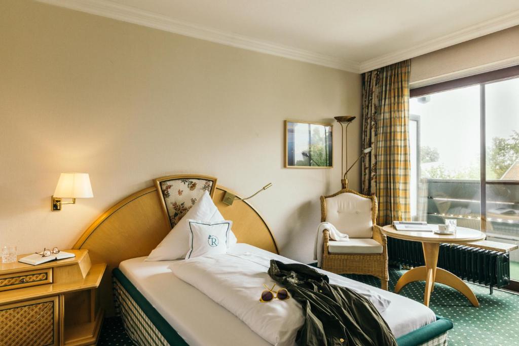Postel nebo postele na pokoji v ubytování Garden Hotel Reinhart