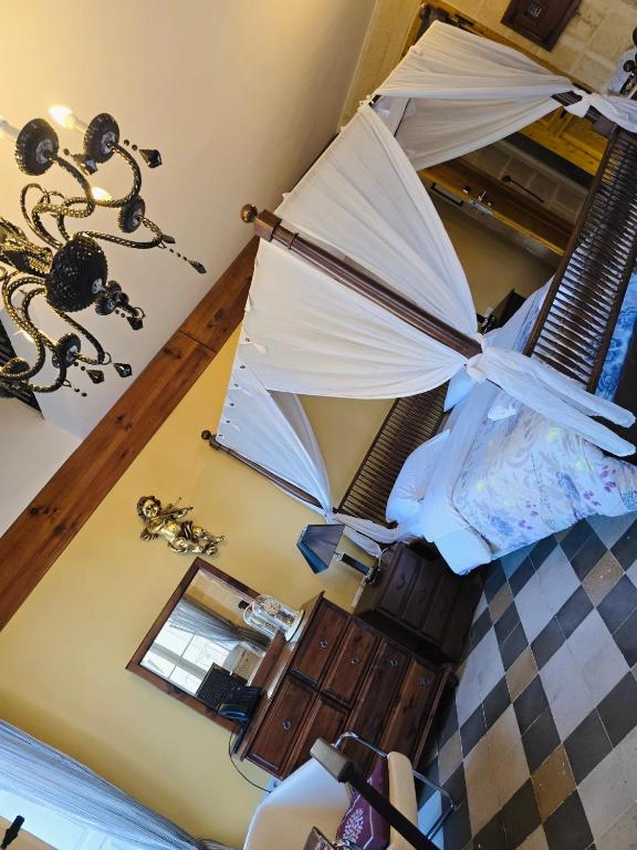 Postel nebo postele na pokoji v ubytování Luciano Valletta Boutique