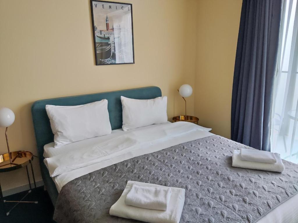 Postel nebo postele na pokoji v ubytování New Gudauri Atrium 211