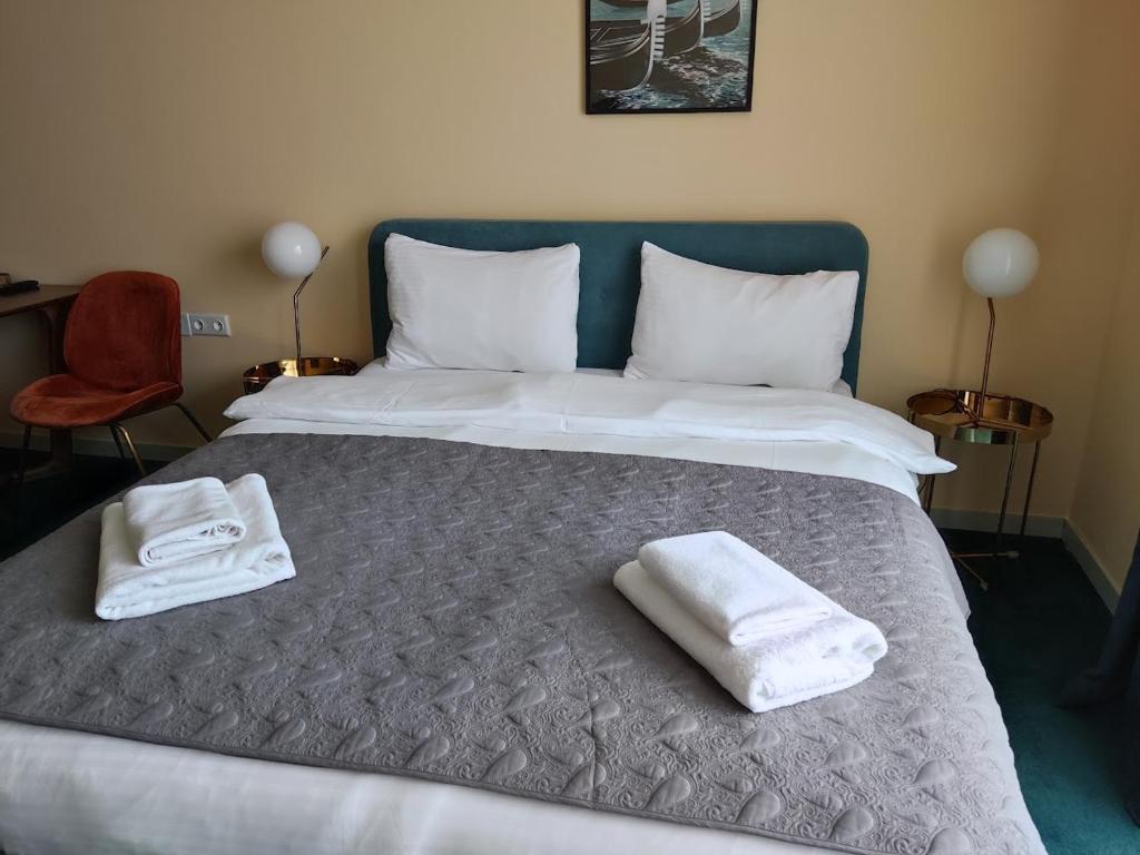 Postel nebo postele na pokoji v ubytování New Gudauri Atrium 211