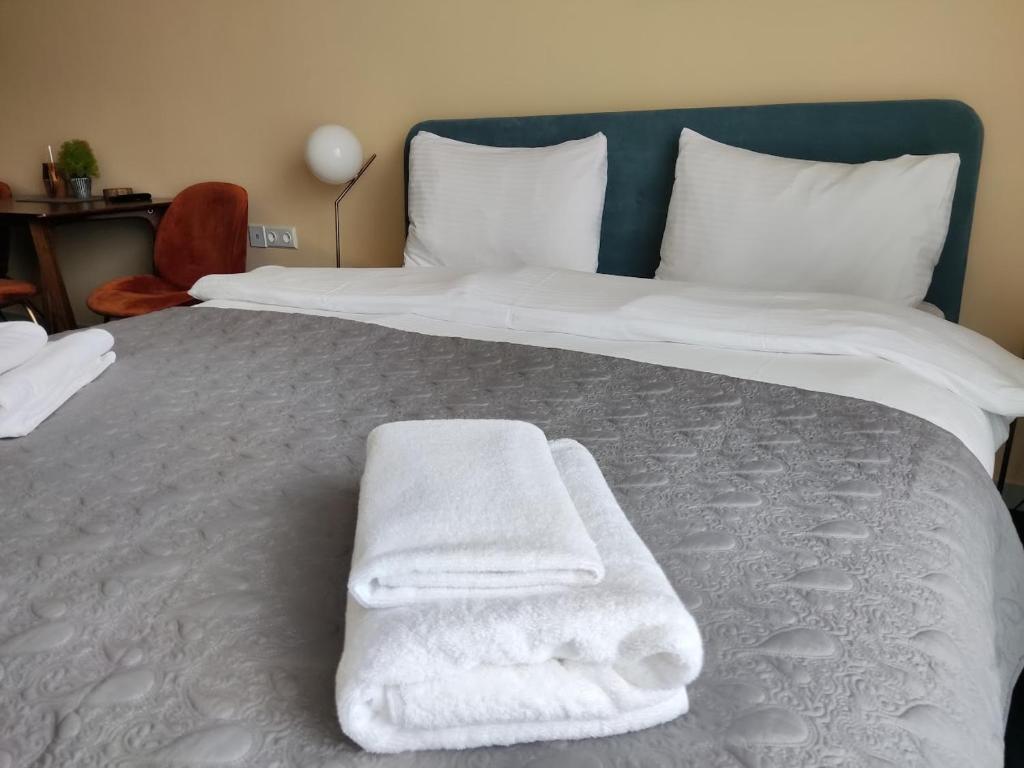 Postel nebo postele na pokoji v ubytování New Gudauri Atrium 211