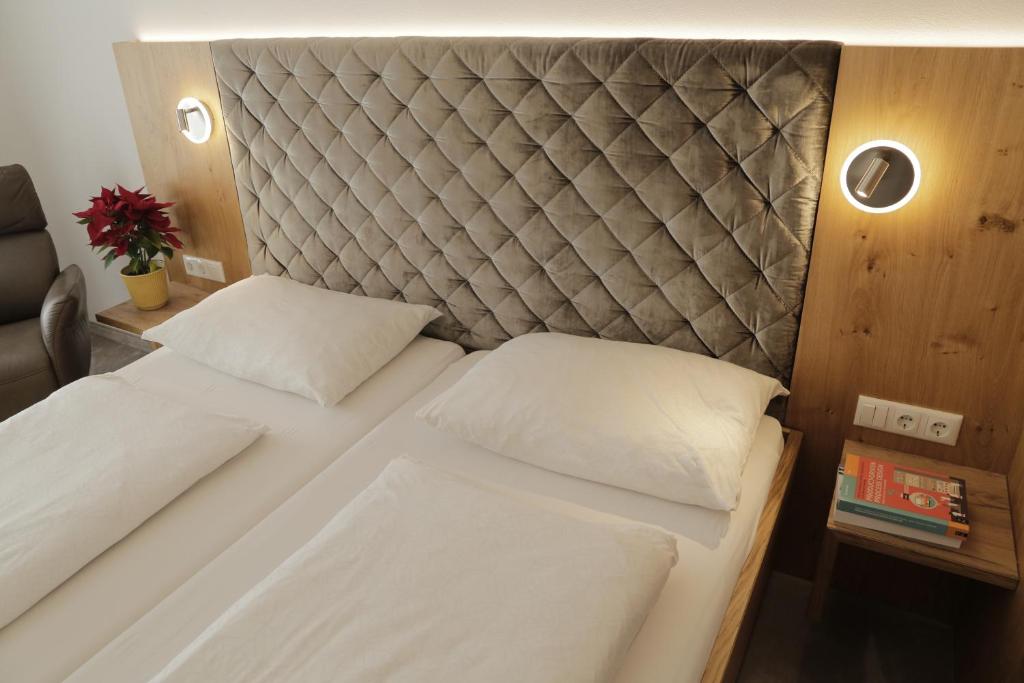 Postel nebo postele na pokoji v ubytování Thurners Boutique Hotel