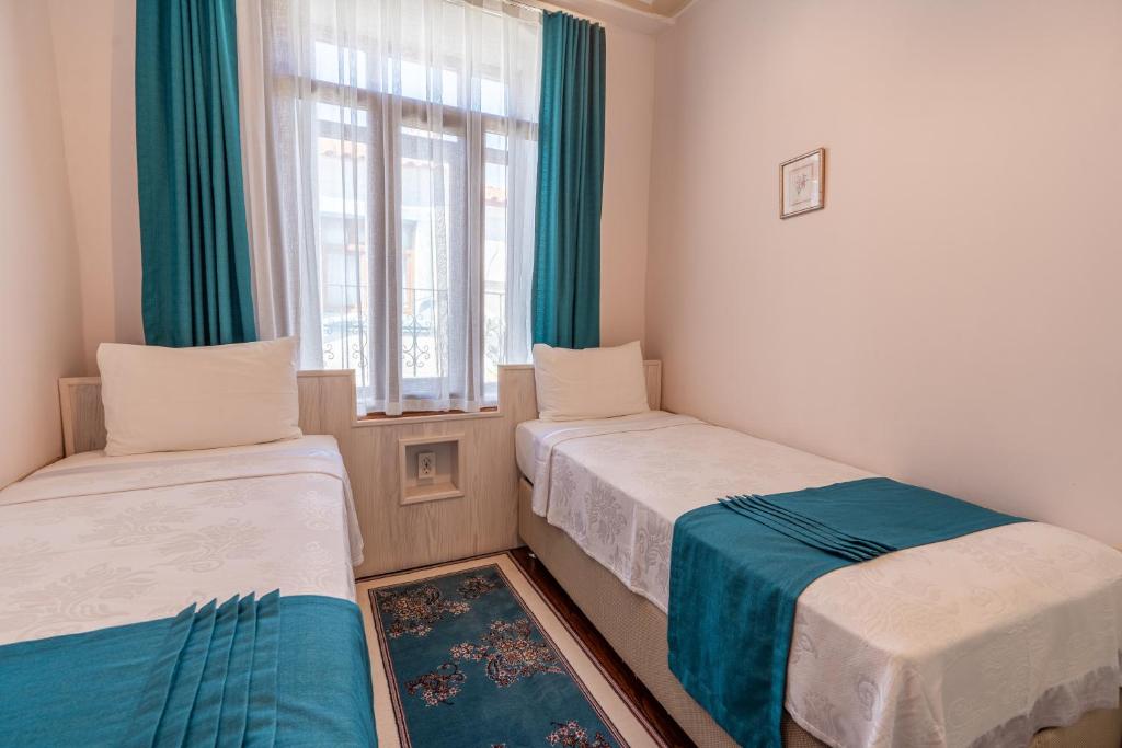 Postel nebo postele na pokoji v ubytování Nar Adaevi
