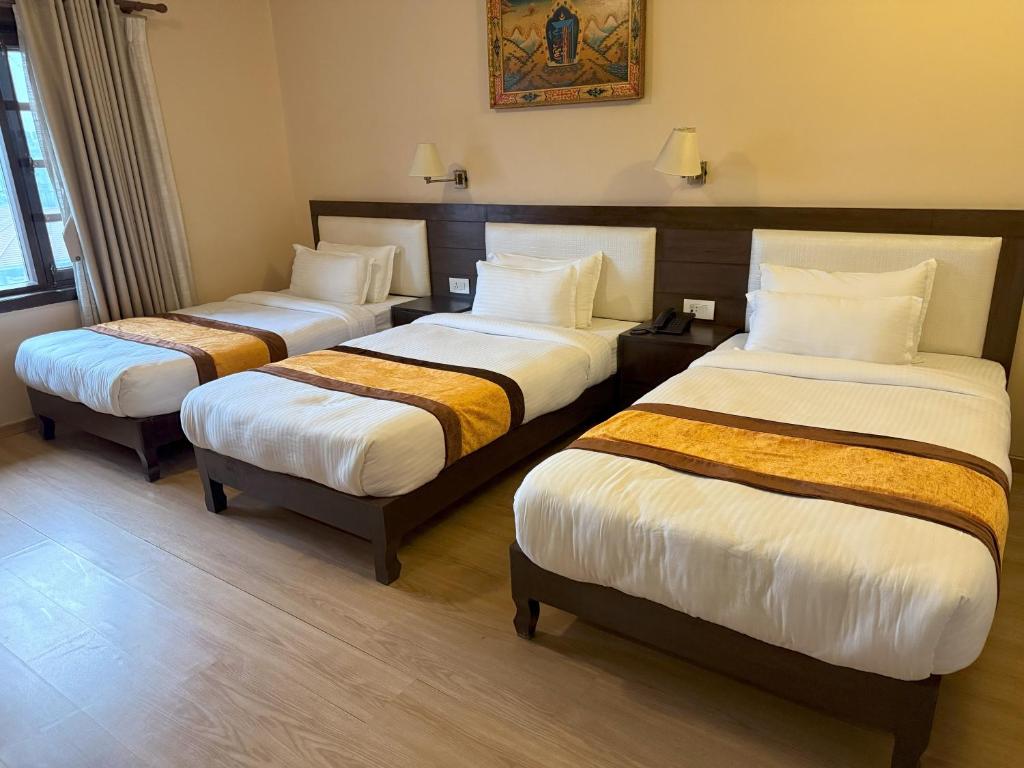 Postel nebo postele na pokoji v ubytování Hotel Shuman, Boudha
